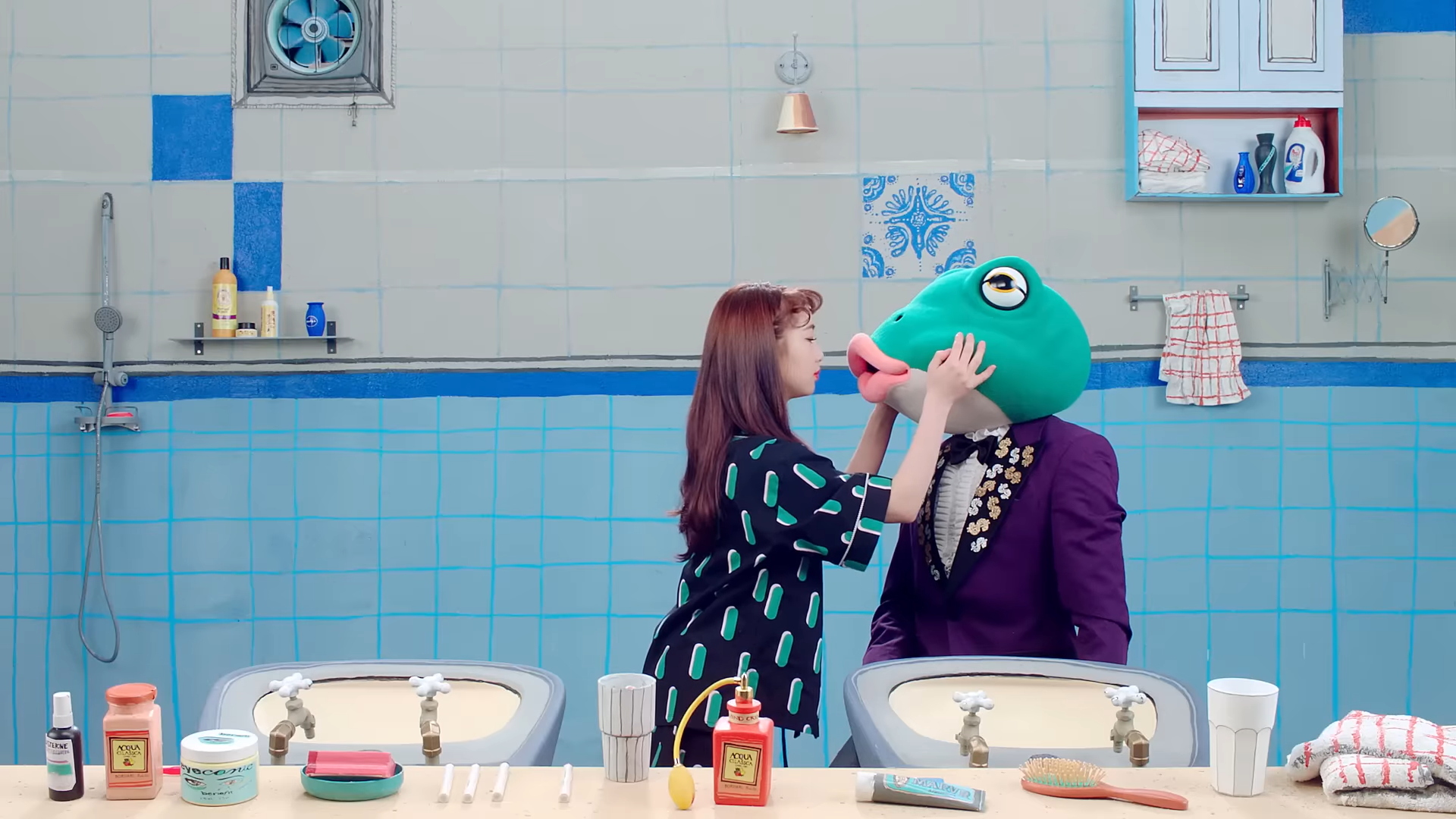 Yeojin leaning in to kiss the frog.